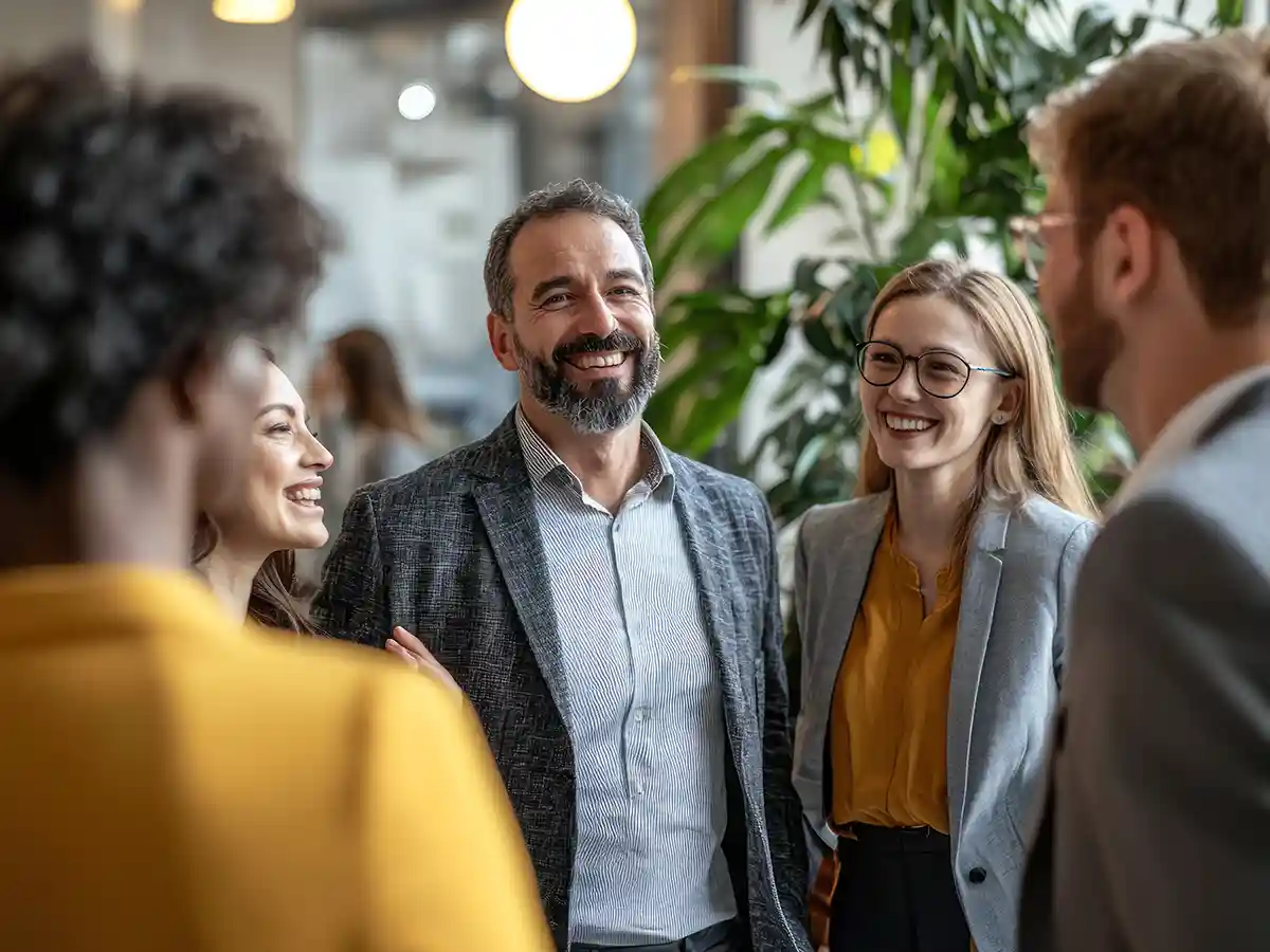 A group of smiling people at an networking event